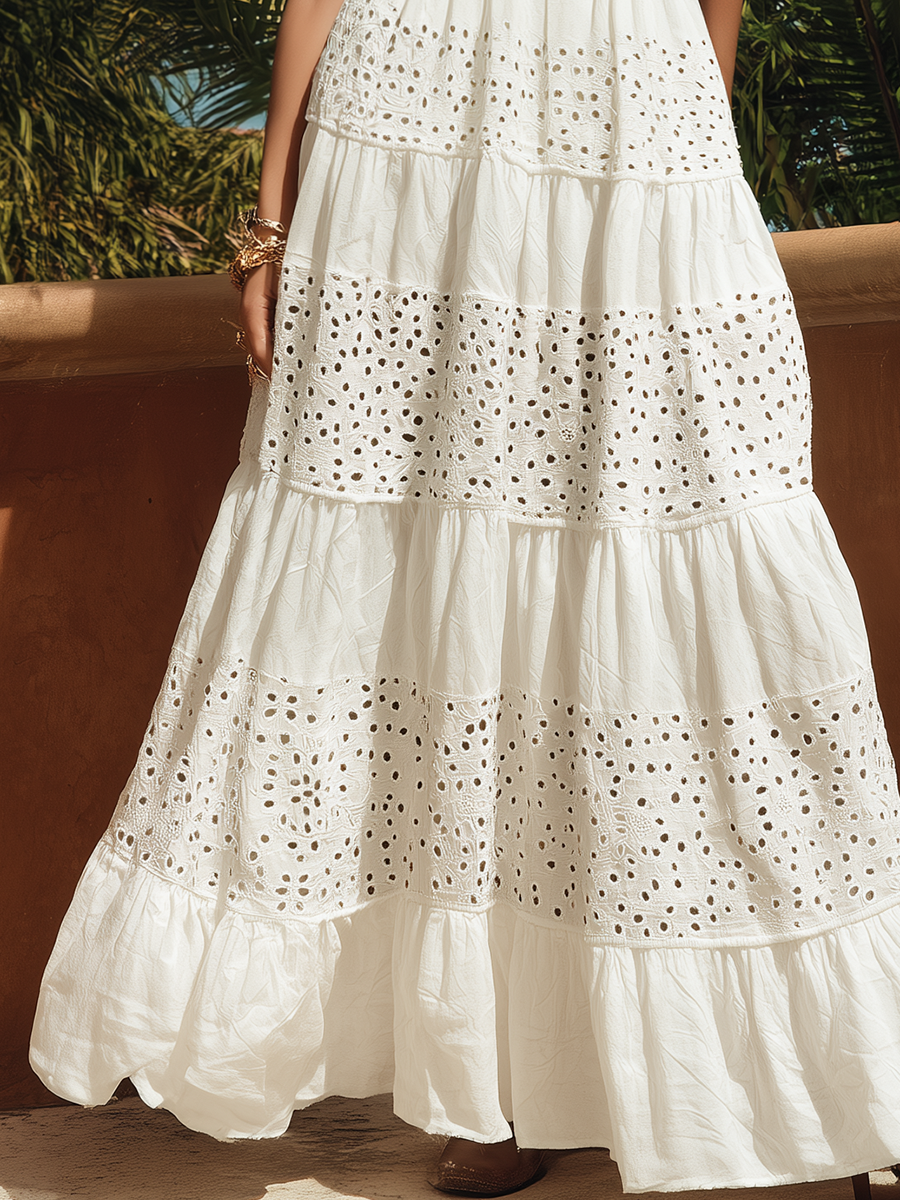 Sleeveless white cotton-linen maxi dress with bohemian cutouts