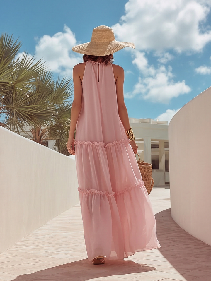 Sleeveless pink chiffon maxi dress with romantic ruffles