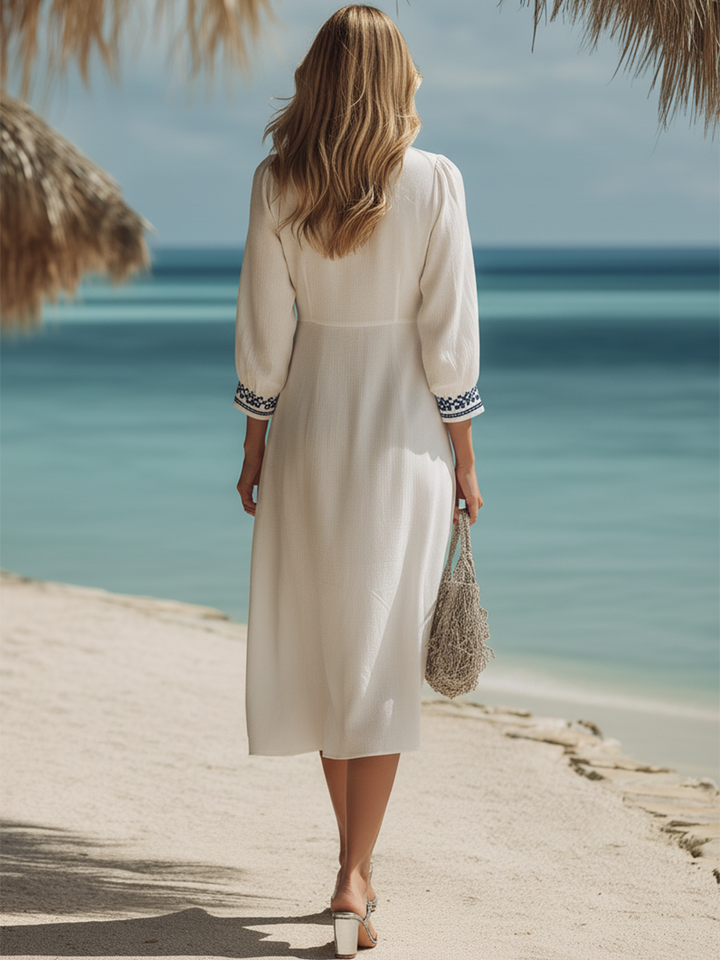 Midi dress in ecru cotton and linen embroidered in blue, ethnic seaside resort style