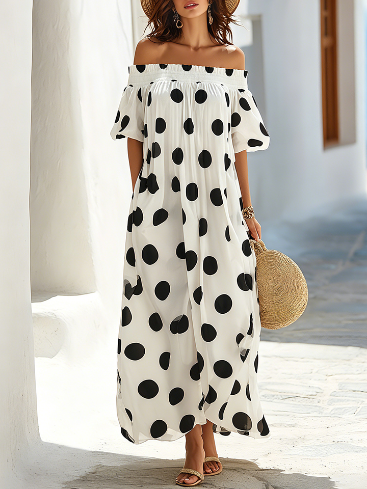Maxi dress with black and white polka dots, seaside resort style, off-the-shoulder neckline
